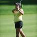 Huron's Madison Smith watches her ball during golf regionals at the University of Michigan Golf Course on Thursday. Melanie Maxwell I AnnArbro.com